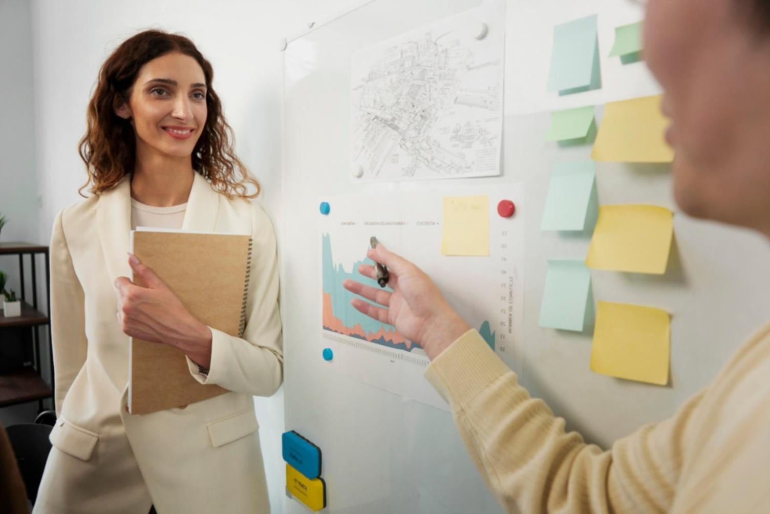 Instructor reviewing financial planning documents with participant during workshop session