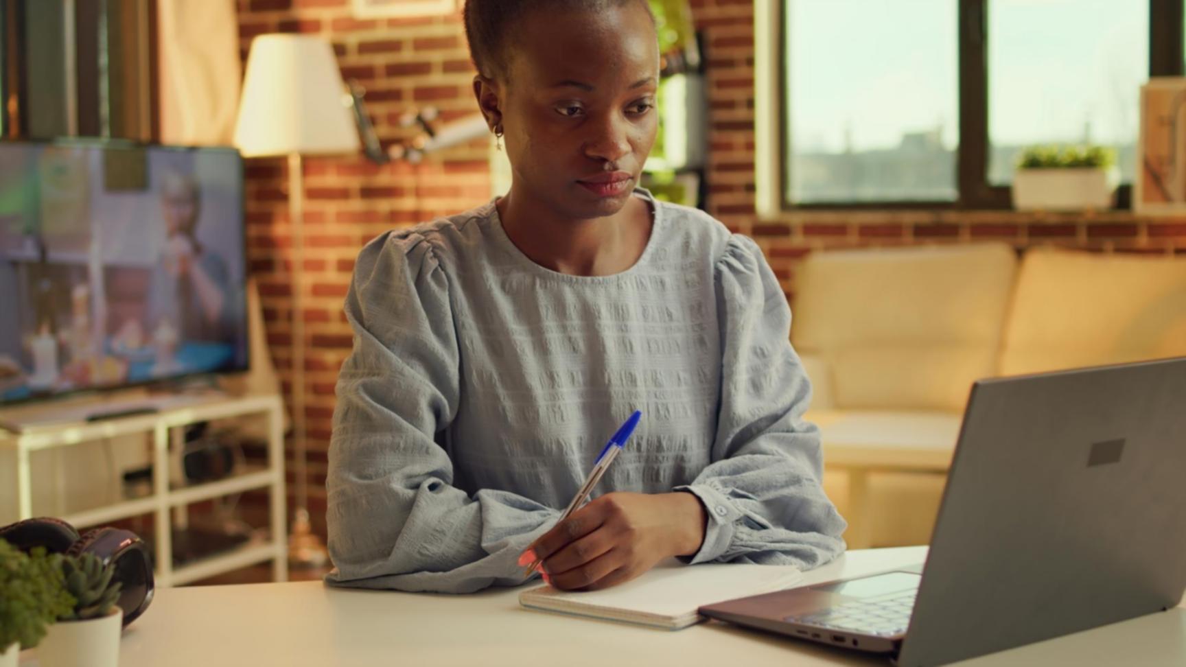 Person reviewing financial documents and budget planning materials